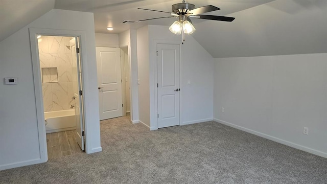 additional living space featuring a ceiling fan, carpet, lofted ceiling, and baseboards