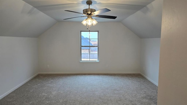 bonus room featuring a ceiling fan, carpet, lofted ceiling, and baseboards