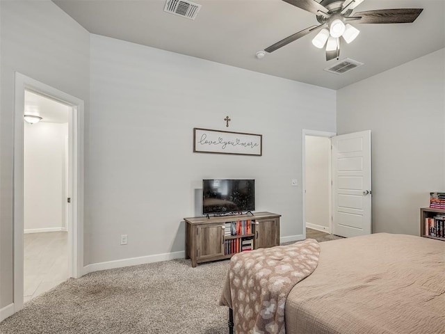 carpeted bedroom featuring ceiling fan, visible vents, and baseboards