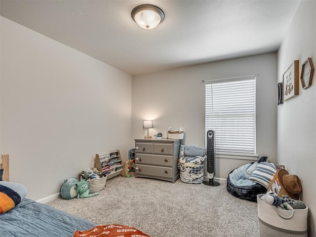 carpeted bedroom with baseboards