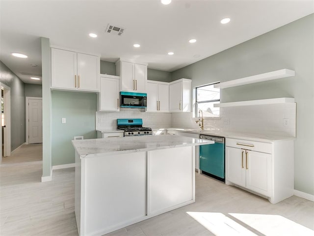 kitchen featuring a center island, open shelves, stove, black microwave, and dishwashing machine