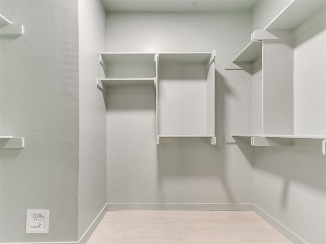 spacious closet with wood finished floors