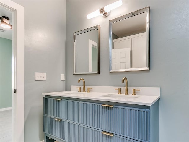 bathroom with double vanity and a sink