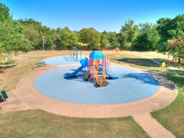 communal playground featuring a yard