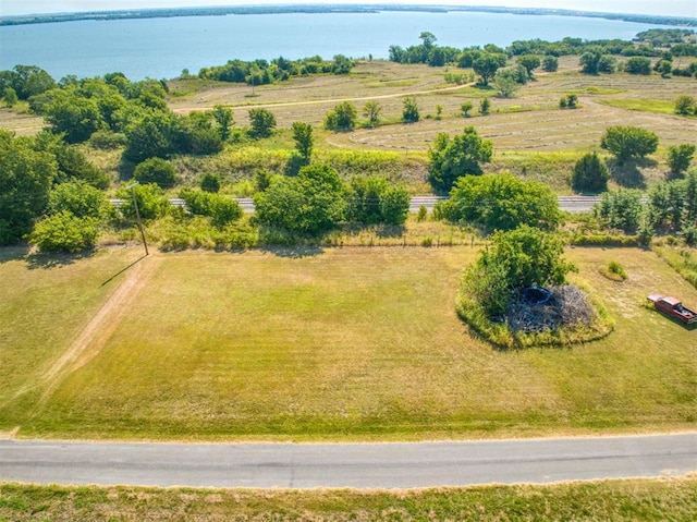 birds eye view of property with a water view and a rural view