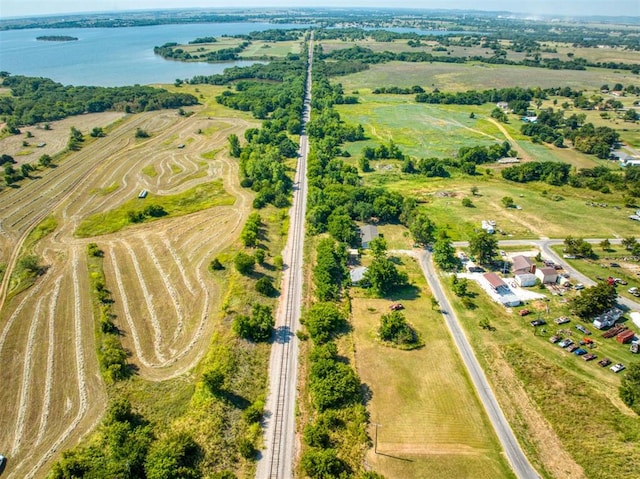 drone / aerial view with a rural view and a water view