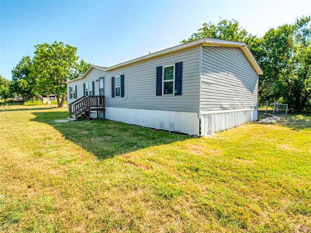 view of property exterior with a yard