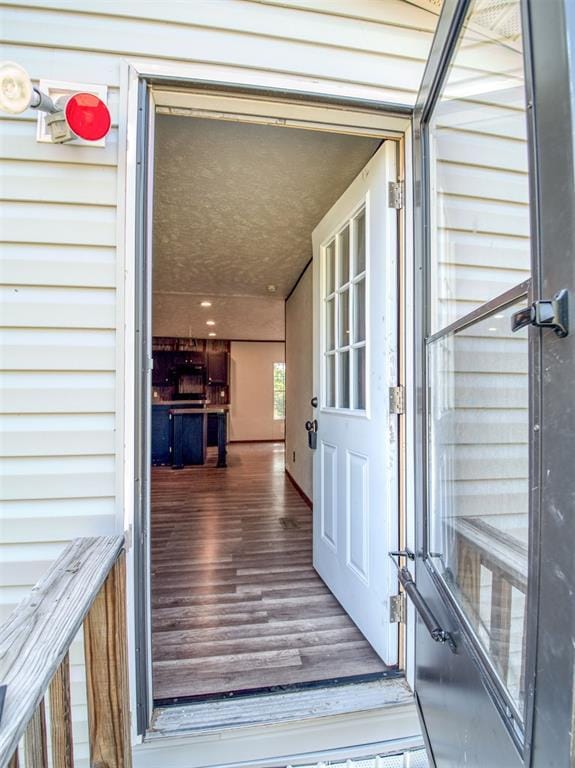 doorway to property with a garage