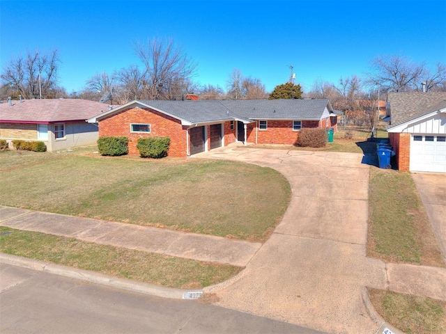 ranch-style house featuring a garage, a front yard, brick siding, and driveway