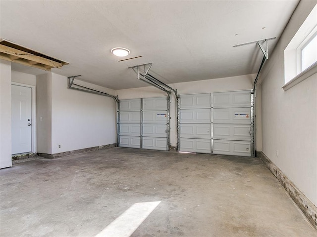 garage featuring baseboards