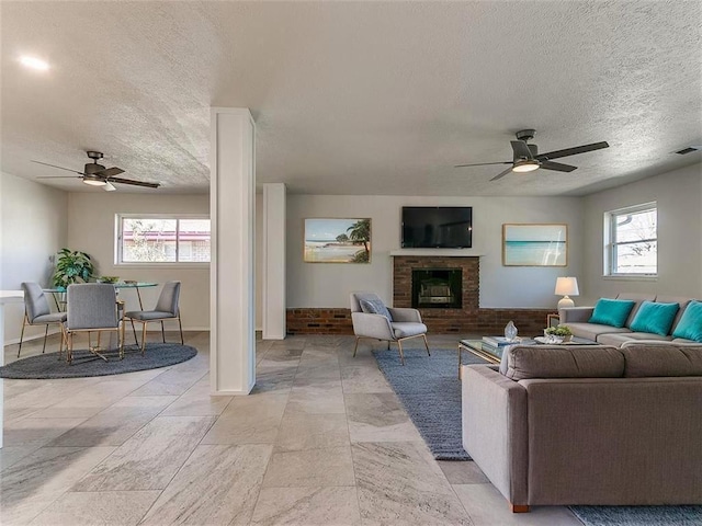 4329 NW 44th St, Oklahoma City, OK 73112 - living area with a ceiling fan, plenty of natural light, and a textured ceiling