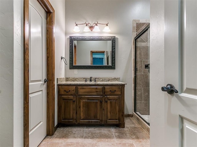 full bathroom with a stall shower and vanity