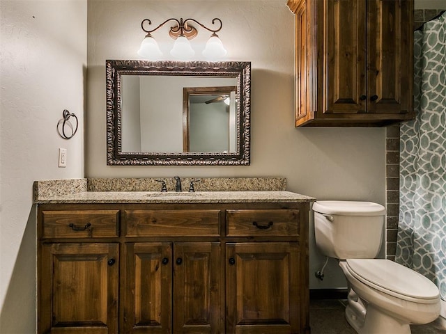 full bathroom with toilet and vanity