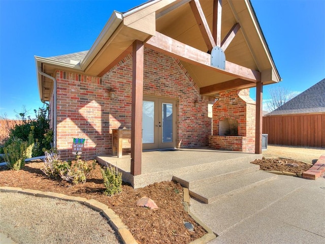 exterior space featuring french doors and fence