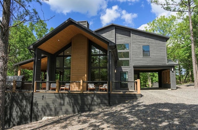 exterior space with gravel driveway