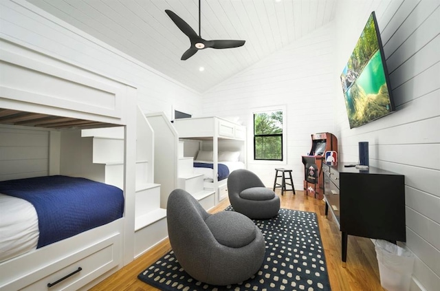 bedroom featuring high vaulted ceiling, wooden ceiling, light wood-style flooring, and a ceiling fan