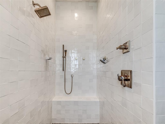 bathroom featuring tiled shower