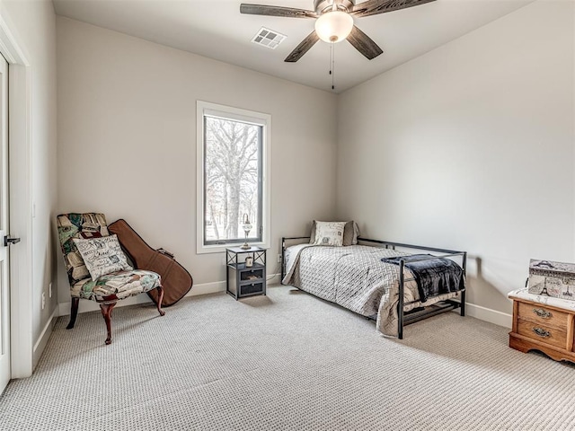 bedroom with light colored carpet, visible vents, and baseboards