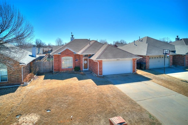 view of front of home with a shingled roof, concrete driveway, an attached garage, fence, and brick siding