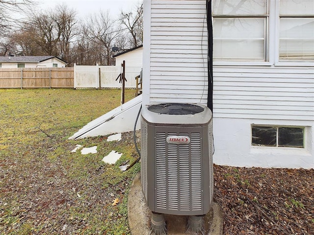 exterior details featuring fence and central AC unit