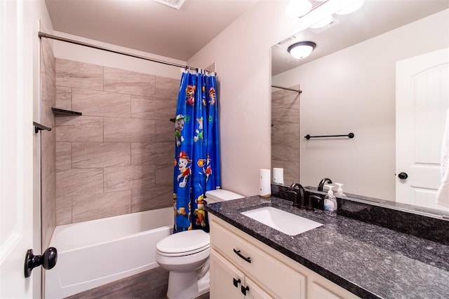 bathroom featuring toilet, shower / bath combo, and vanity