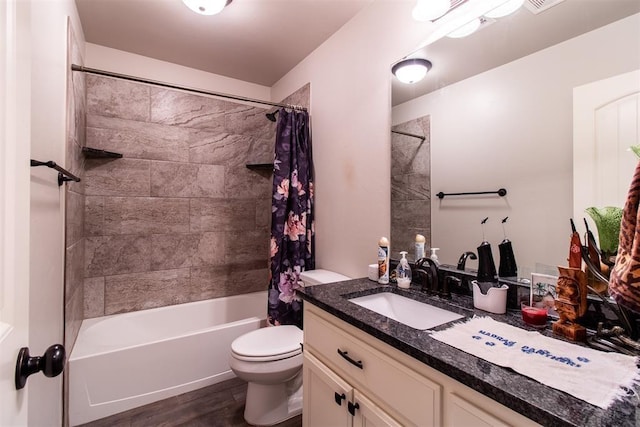 full bath with visible vents, shower / bathtub combination with curtain, toilet, vanity, and wood finished floors