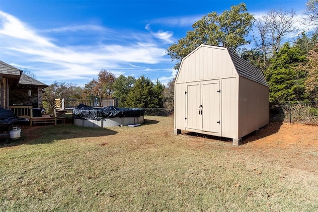 view of shed featuring a fenced in pool and fence