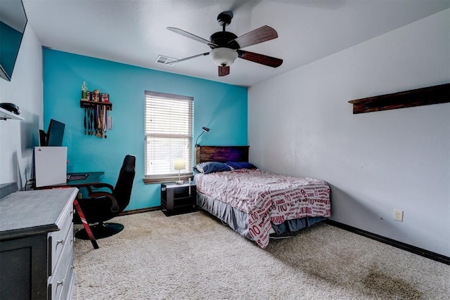 carpeted bedroom with ceiling fan, visible vents, and baseboards