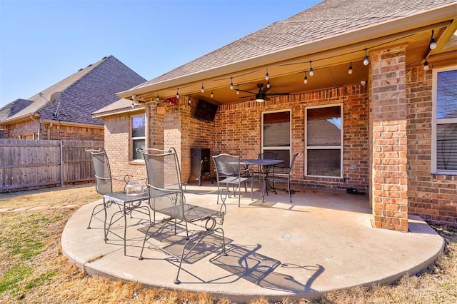 view of patio / terrace with outdoor dining space, fence, and ceiling fan