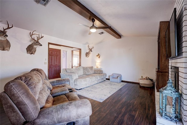 living area featuring lofted ceiling with beams, a fireplace, visible vents, and wood finished floors