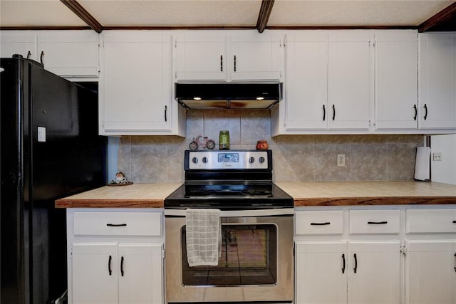 kitchen featuring electric stove, freestanding refrigerator, light countertops, under cabinet range hood, and white cabinetry