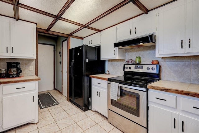 kitchen featuring stainless steel electric range oven, freestanding refrigerator, light countertops, under cabinet range hood, and white cabinetry