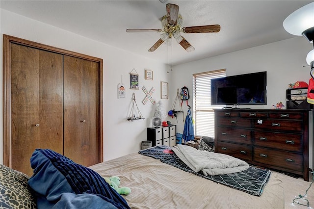 bedroom featuring a ceiling fan and a closet