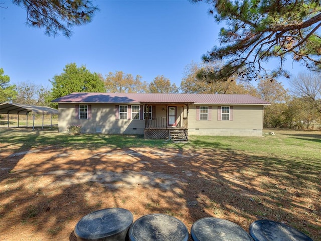 view of front of home with metal roof, a front lawn, crawl space, and a detached carport