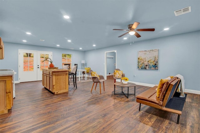 interior space featuring dark wood-style floors, french doors, recessed lighting, visible vents, and electric range oven