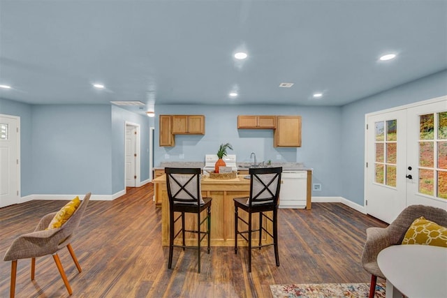 kitchen with dark wood-style floors, french doors, white dishwasher, and recessed lighting