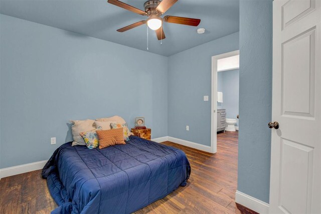 bedroom featuring a ceiling fan, baseboards, and wood finished floors