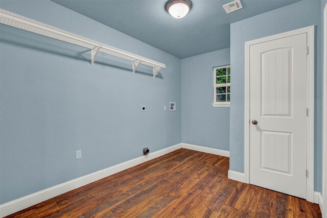 laundry room featuring hookup for an electric dryer, laundry area, washer hookup, wood finished floors, and visible vents