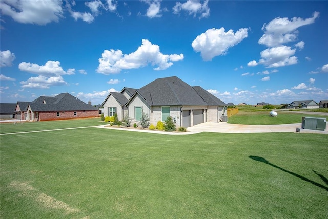 back of property featuring a garage, roof with shingles, a lawn, and concrete driveway