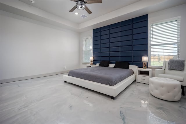 bedroom featuring visible vents, baseboards, a ceiling fan, a tray ceiling, and recessed lighting