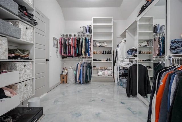 spacious closet with marble finish floor