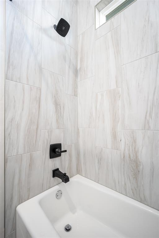 bathroom featuring  shower combination