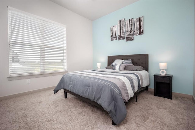 bedroom with carpet and baseboards