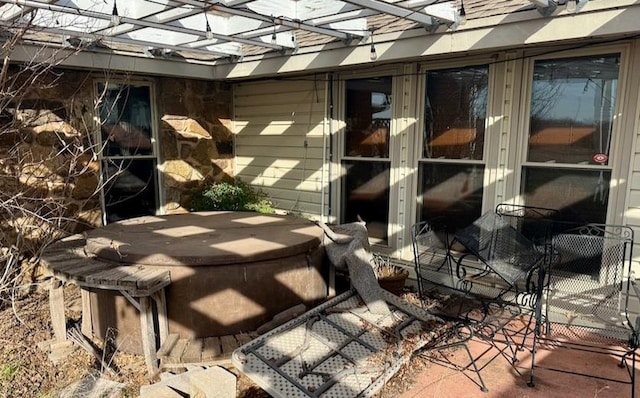 view of patio featuring a hot tub