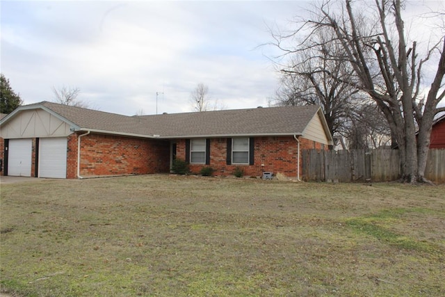 ranch-style house with a garage, brick siding, fence, and a front lawn