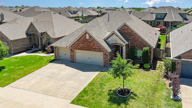 1412 Reid Pryor Rd, Norman, OK 73072 - view of front of home with a garage, brick siding, a residential view, and driveway