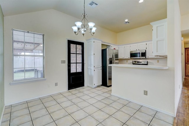 kitchen with visible vents, light countertops, stainless steel appliances, plenty of natural light, and white cabinetry