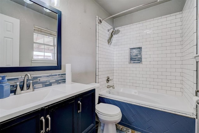 bathroom featuring vanity, toilet, tasteful backsplash, and shower / bathtub combination