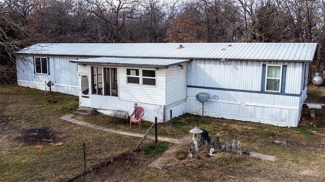 manufactured / mobile home with a sunroom and metal roof