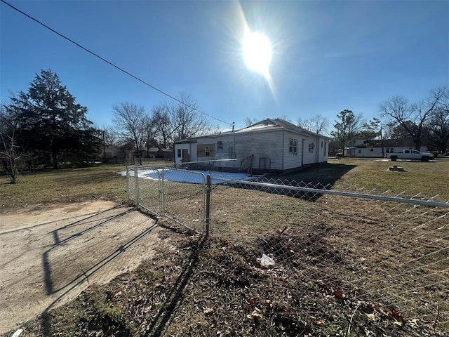 rear view of property with fence